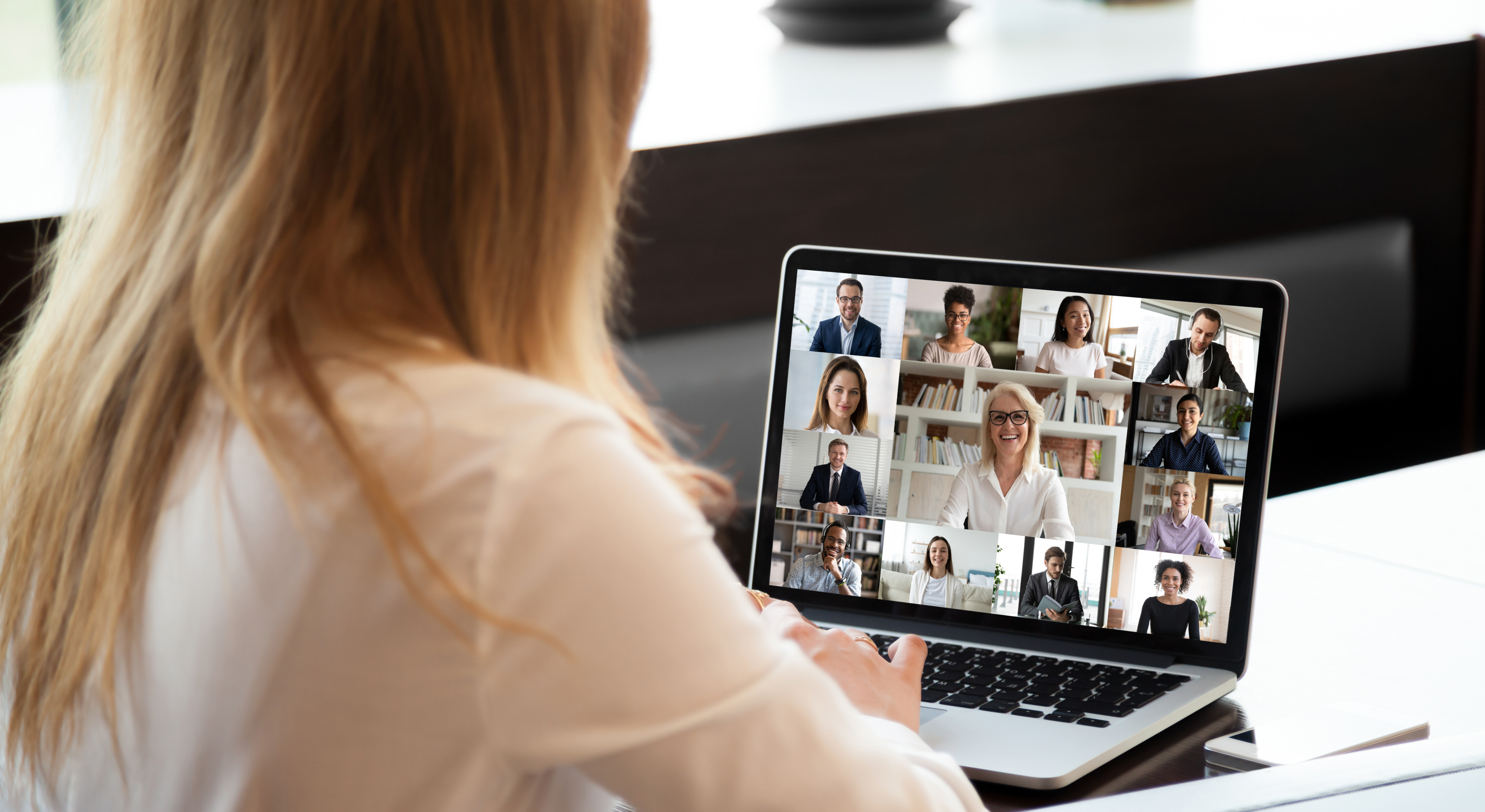 A person joining a video call on their laptop