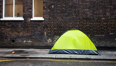 Yellow tent pitched on a street