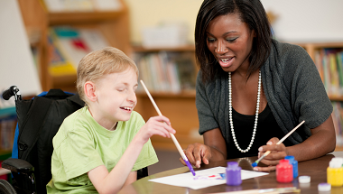 Disabled male child with female carer