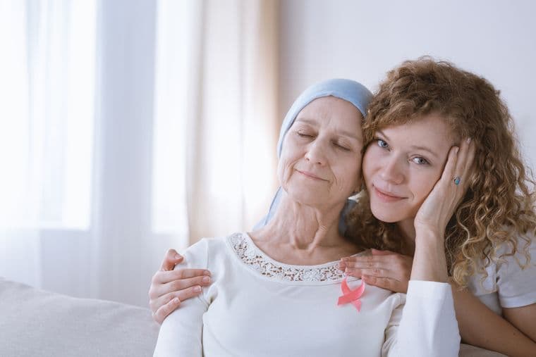 An older woman with ovarian cancer and her daughter